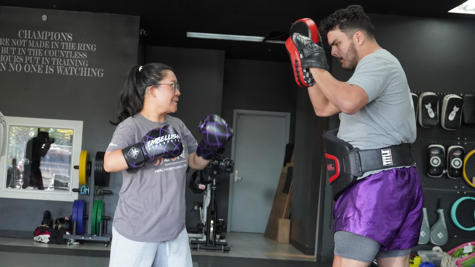Adult kickboxing pad work at Embellish Kickboxing Academy in Elk Grove.